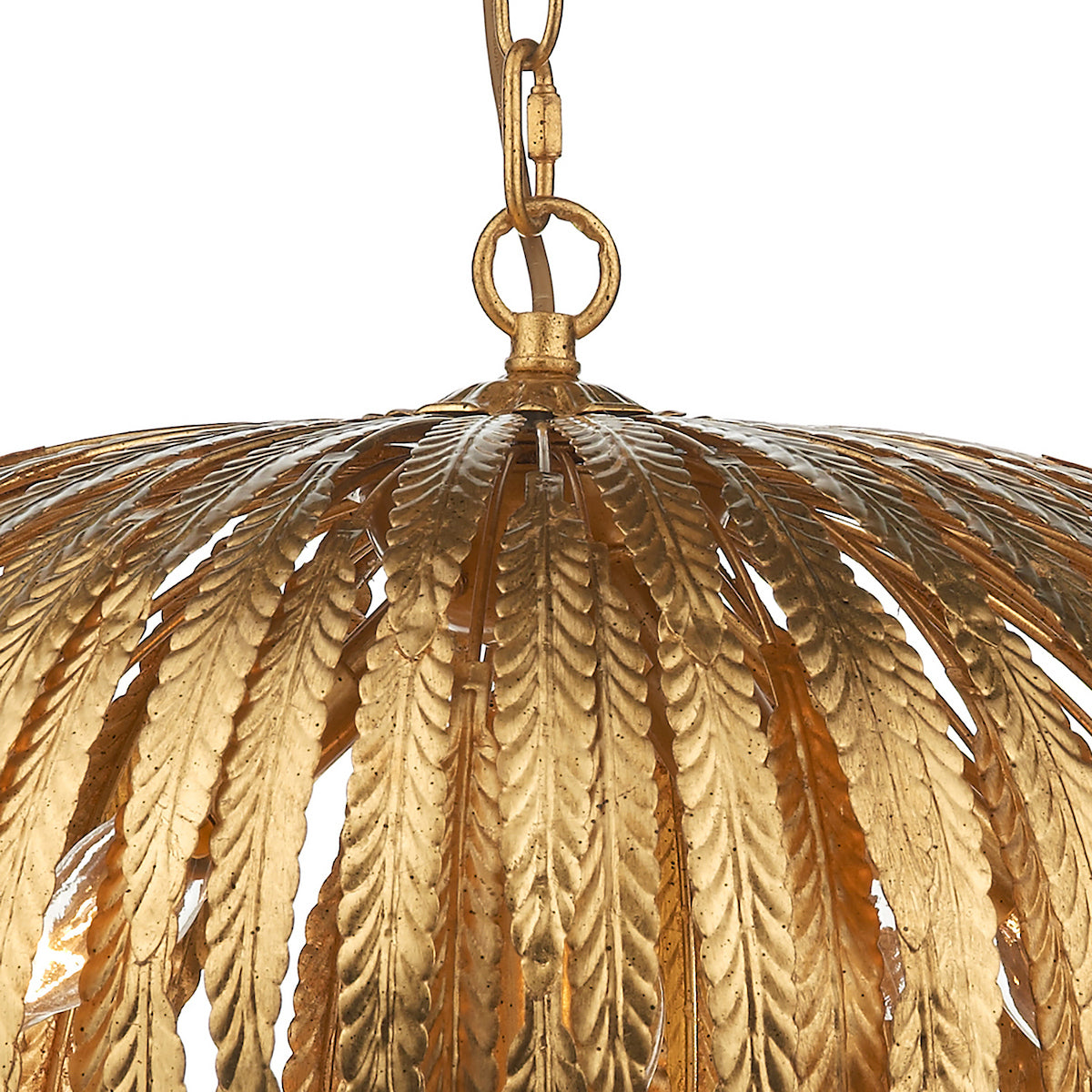 Close-up of a gold chandelier with a leaf-like design, hanging from a chain.
