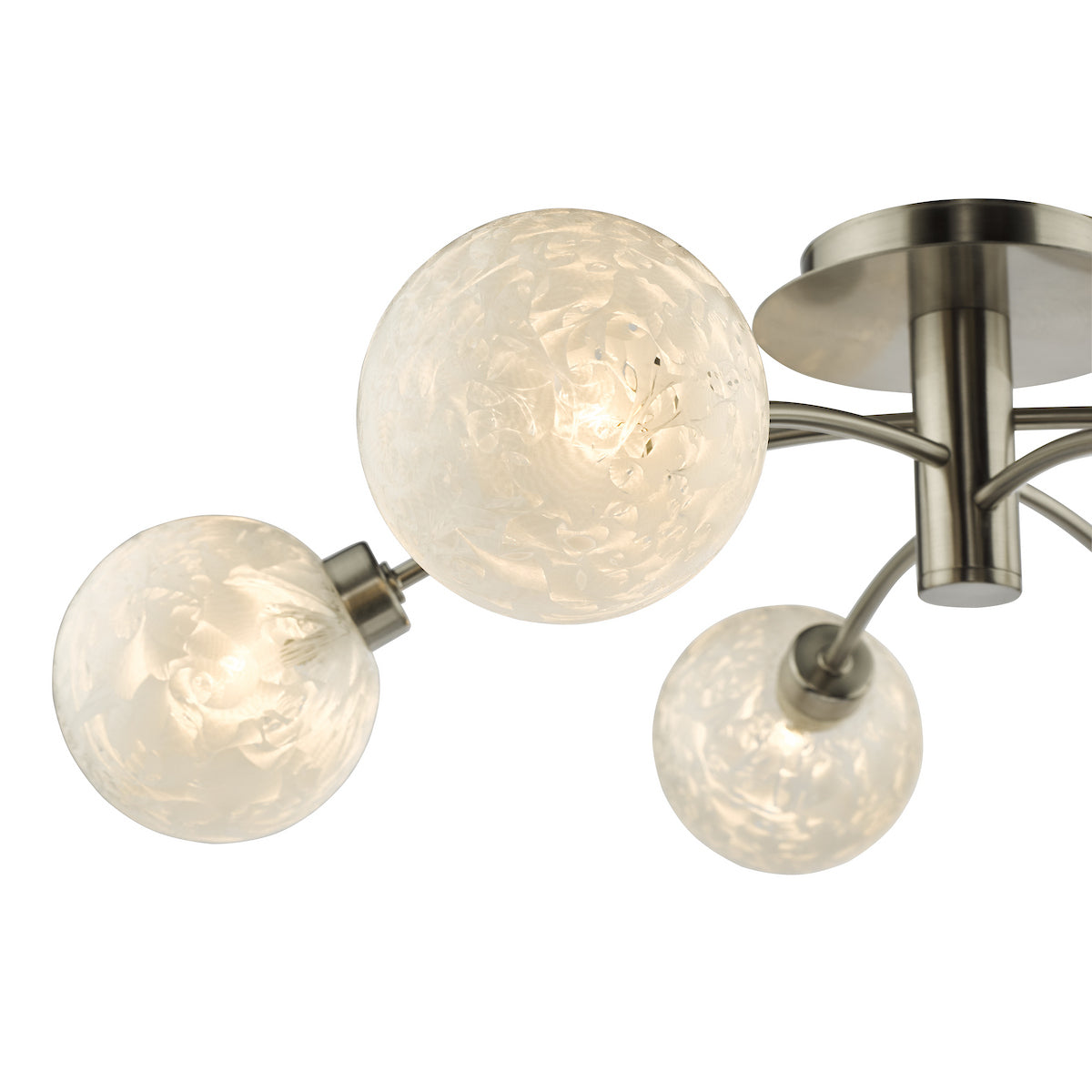 Close-up of a modern ceiling light with three frosted glass globe shades and brushed nickel arms.