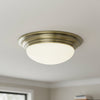 Barclay Small IP44 Flush Mount Ceiling Light In Antique Brass with Opal Glass