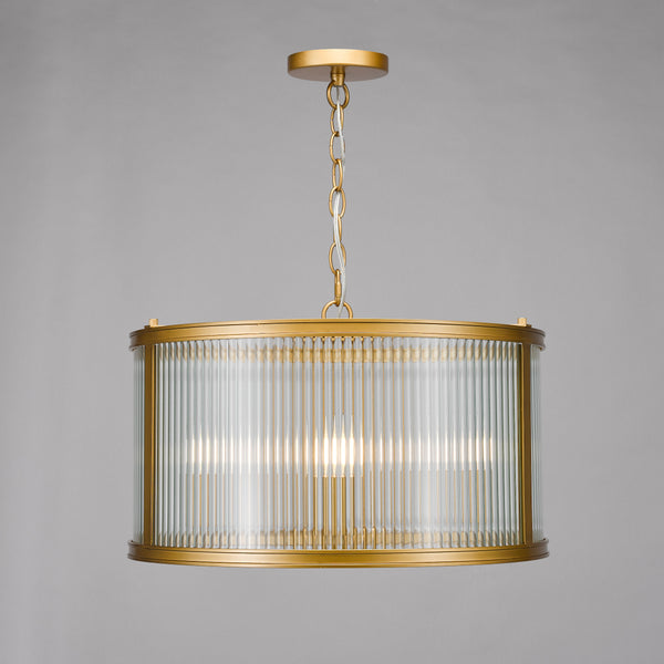 Gold chandelier with a cylindrical fluted glass shade