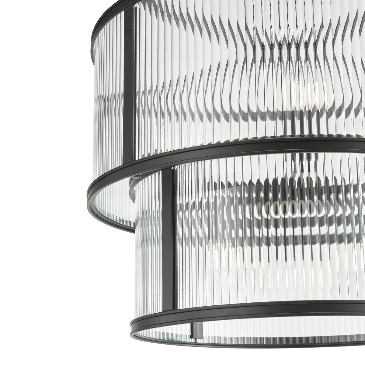 Close-up of a two-tiered chandelier with ribbed glass panels and black metal frames