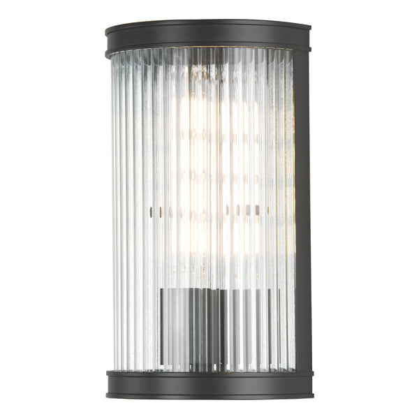 Black outdoor wall light with clear ribbed glass shade