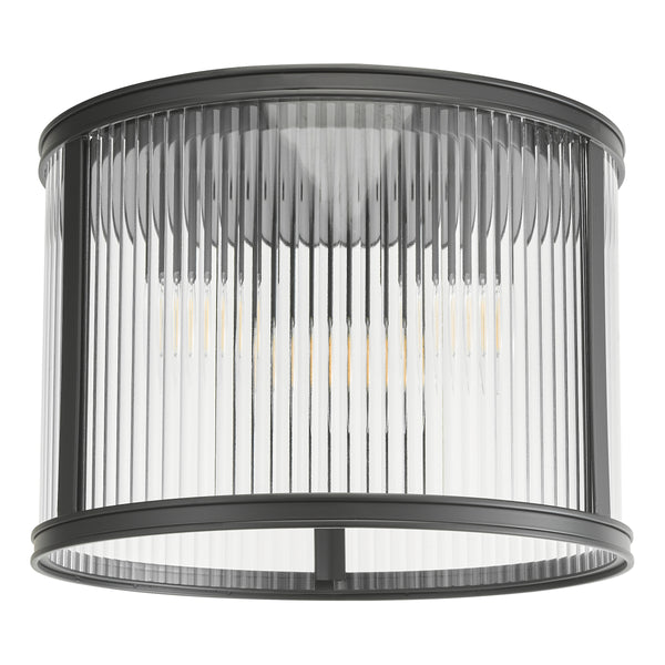 Black metal and clear fluted glass flush mount light fixture with exposed bulbs