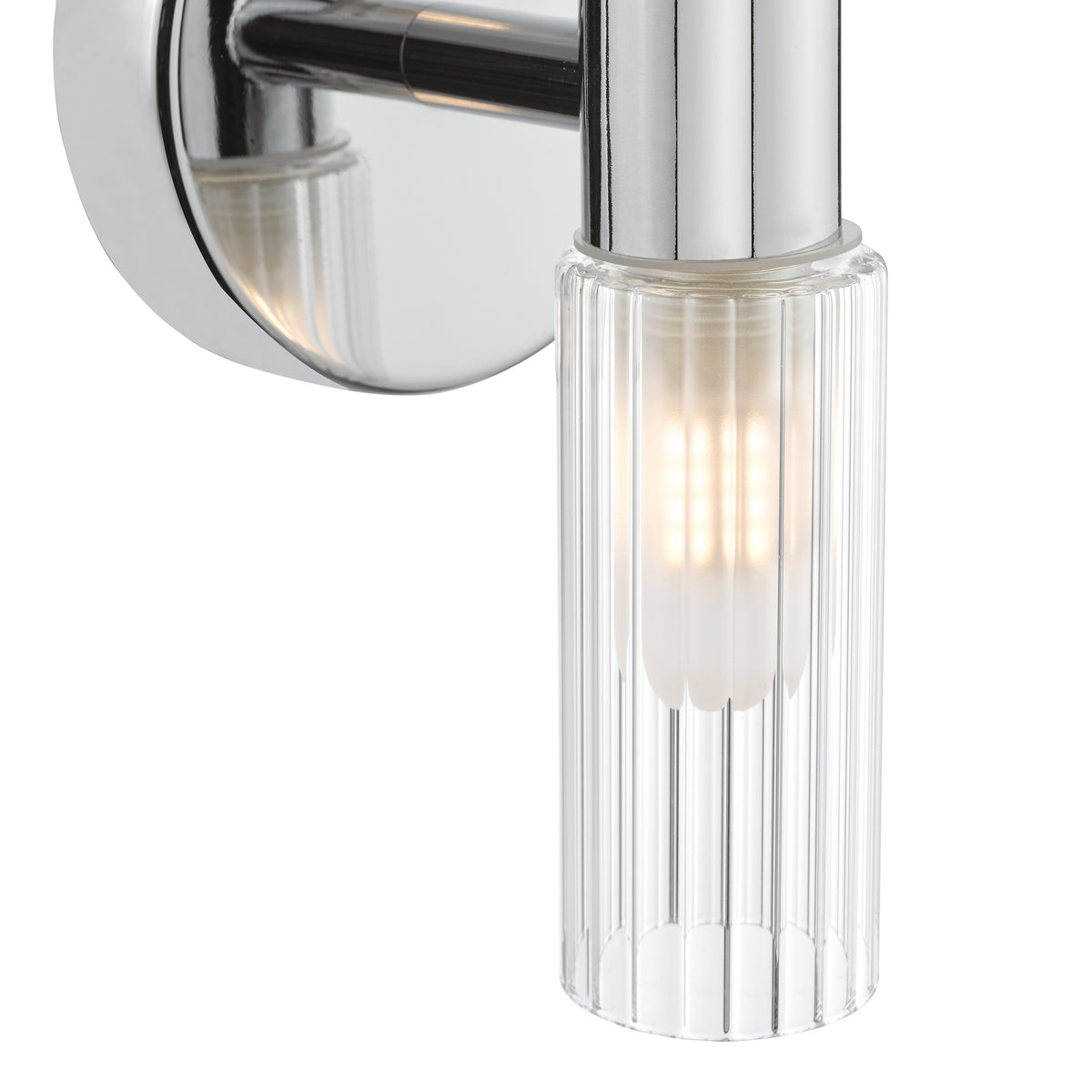 Chrome wall light with a ribbed glass shade and an illuminated bulb