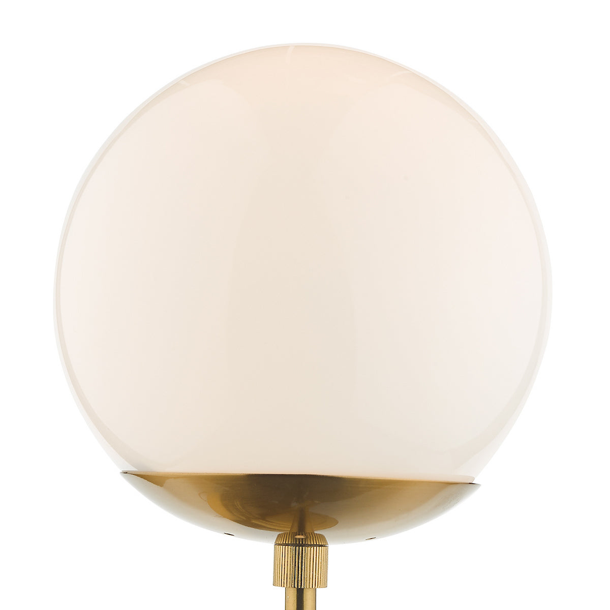 White spherical glass shade with a brass base