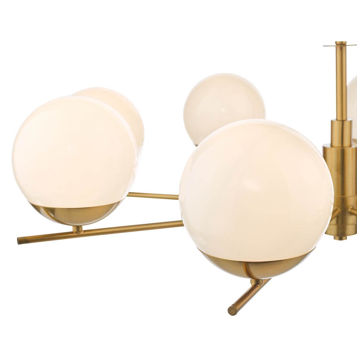 Close up of a brass chandelier with multiple white spherical glass shades