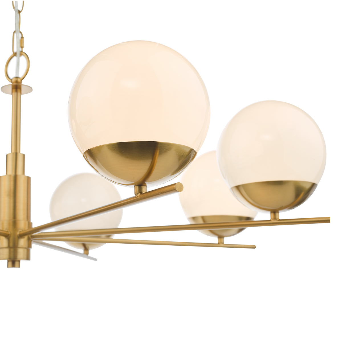 Close up of a brass chandelier with several white globe lights