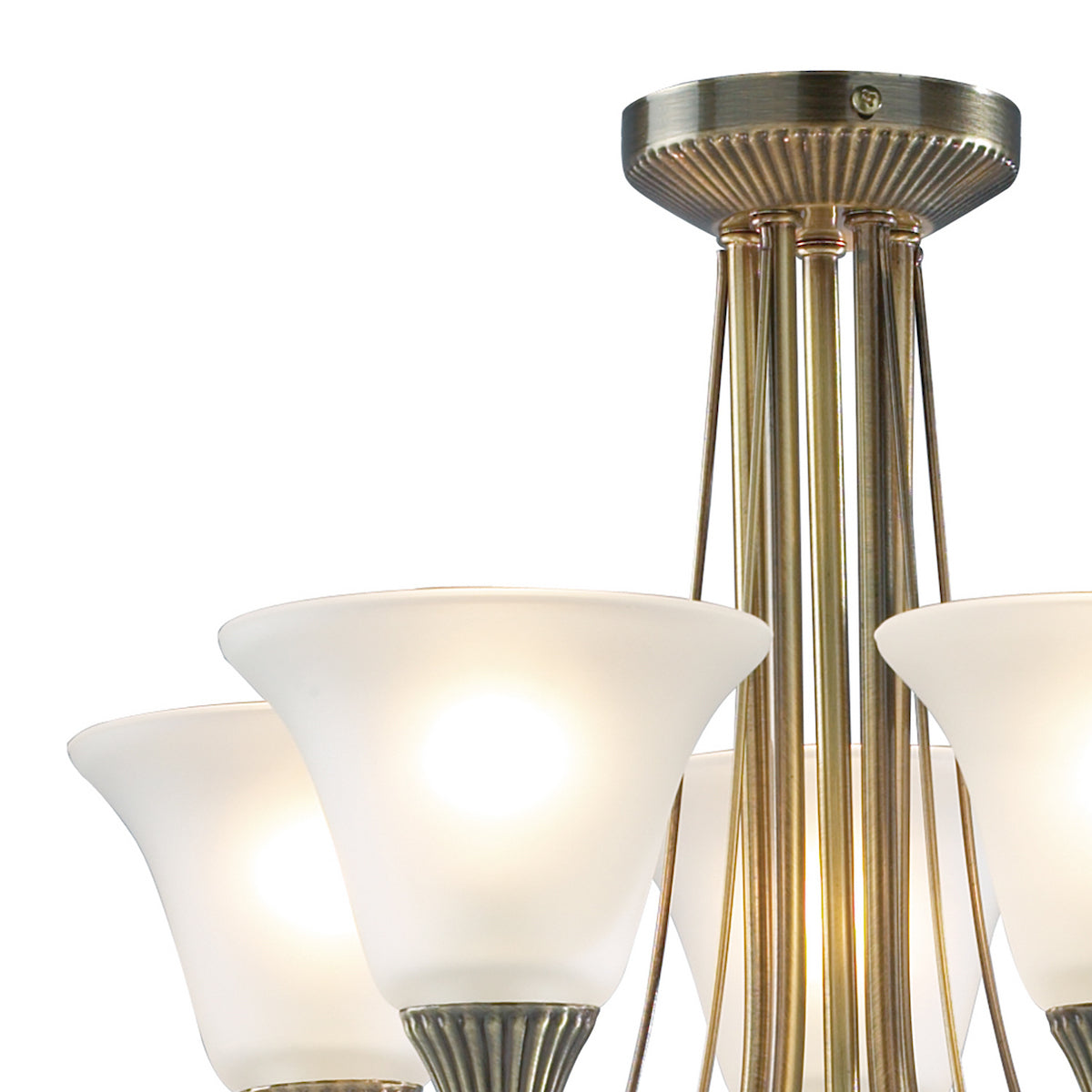 Close-up of a bronze chandelier with frosted glass shades, illuminated against a white background.