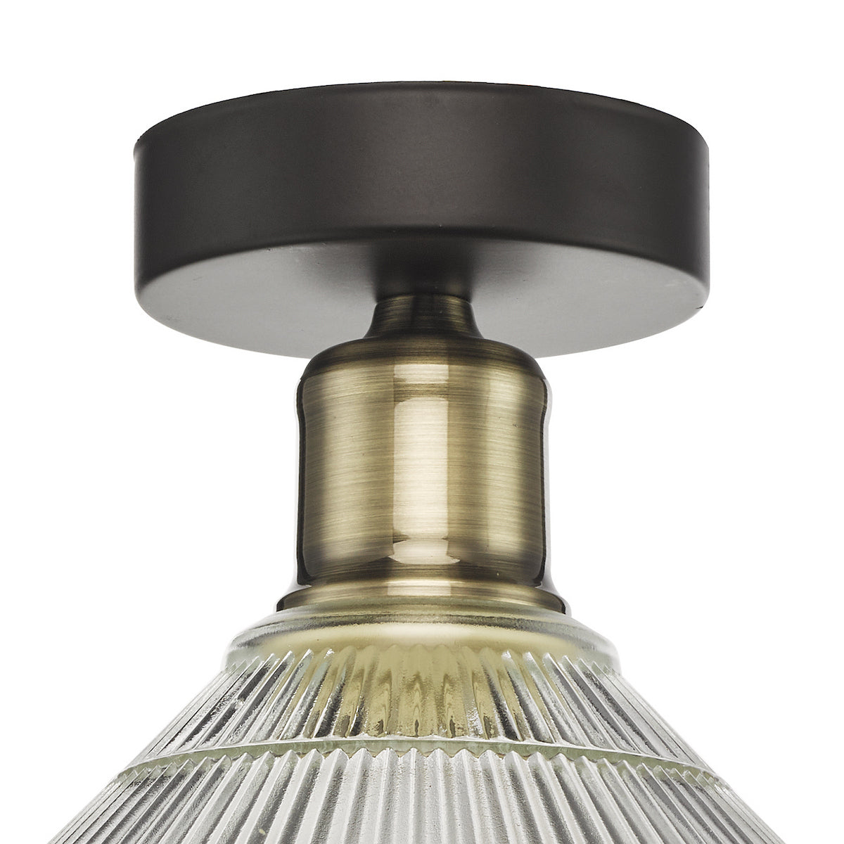 Close up of a ceiling light fixture with a dark bronze base, antique brass stem, and ribbed glass shade