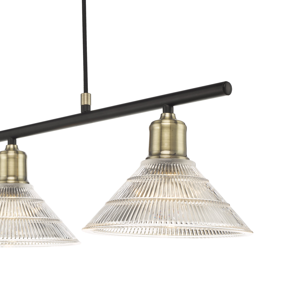 Three light chandelier with clear ribbed glass shades and antique brass accents on a black bar