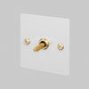 One Gang 2 Way Light Switch in White with Brass Linear Knurled Toggle