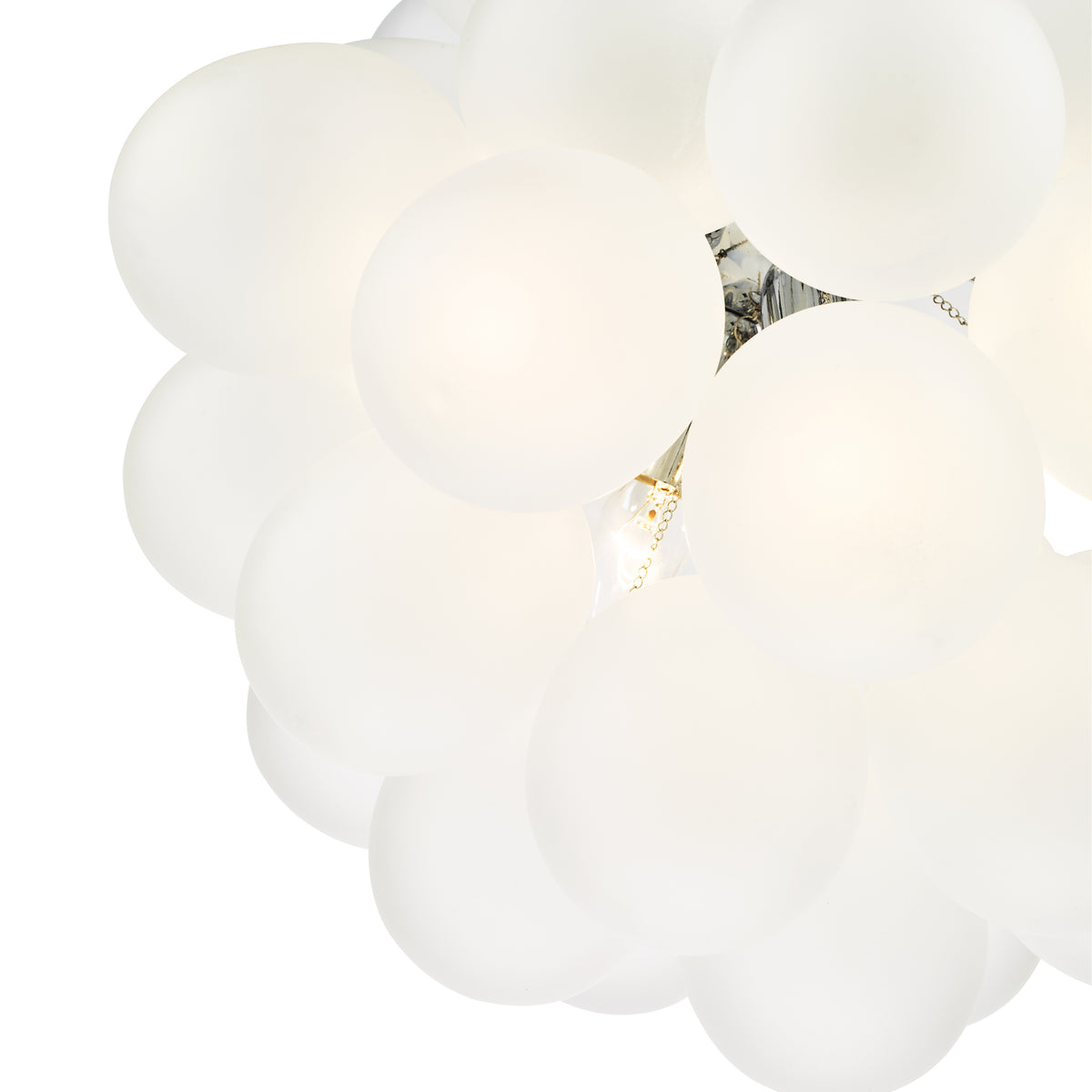 Close up of a white chandelier with many round bulbs