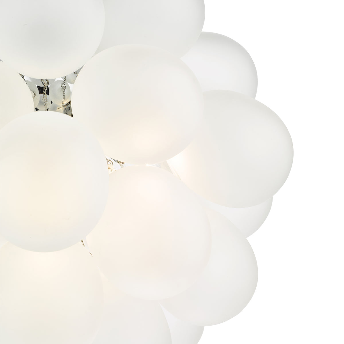 Close up of a white chandelier with round glass shades