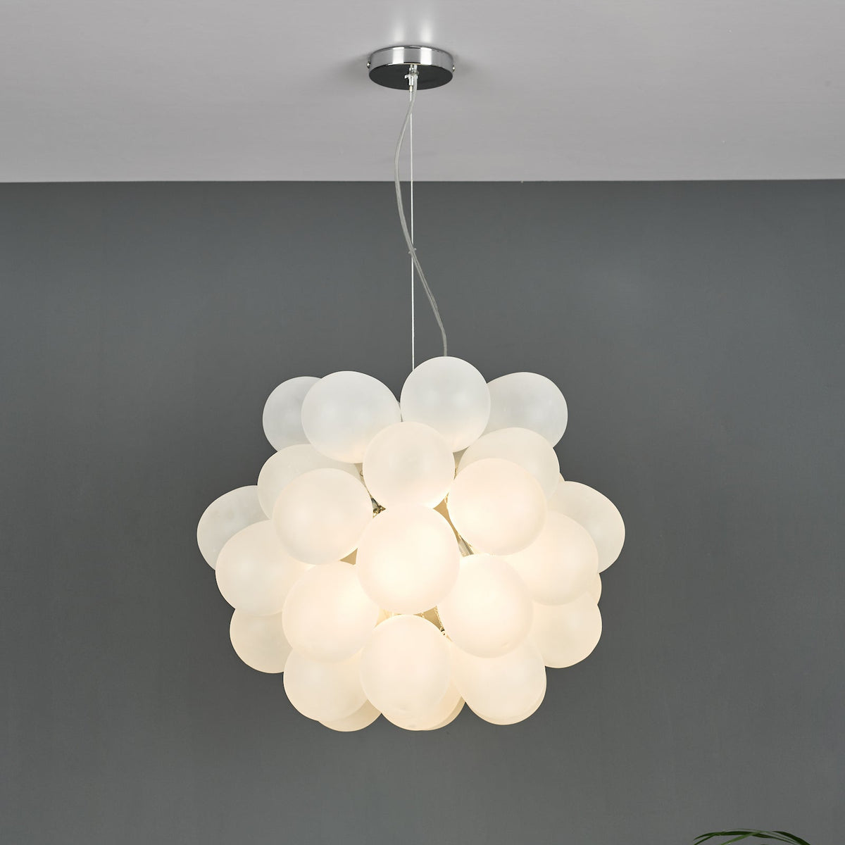 White glass globe pendant light with chrome ceiling rose