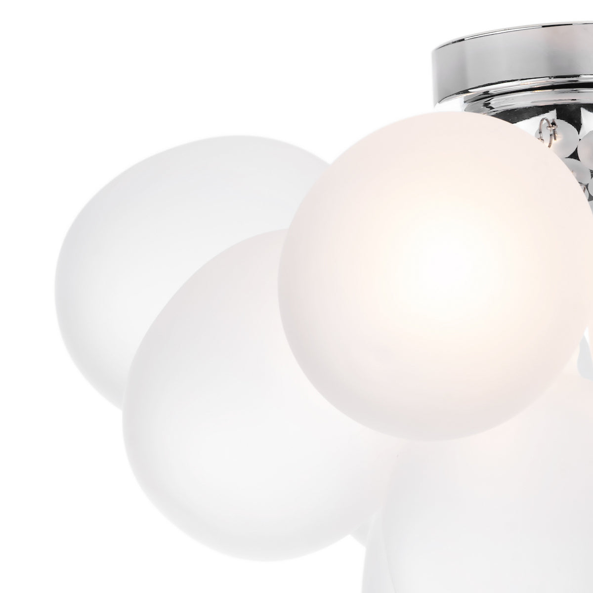 Close up of a ceiling light with multiple white spherical shades, one of which is illuminated