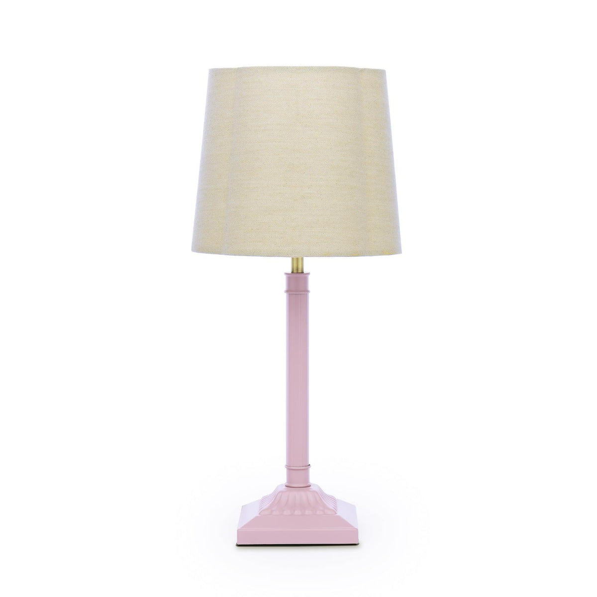 Table lamp with a pink fluted base and a beige fabric drum shade