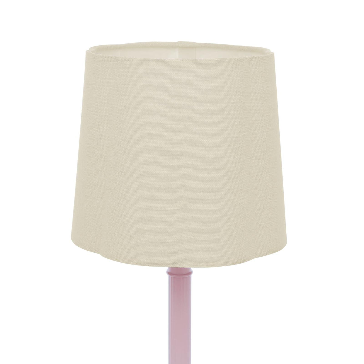 Beige fabric drum lamp shade on a pink lamp base