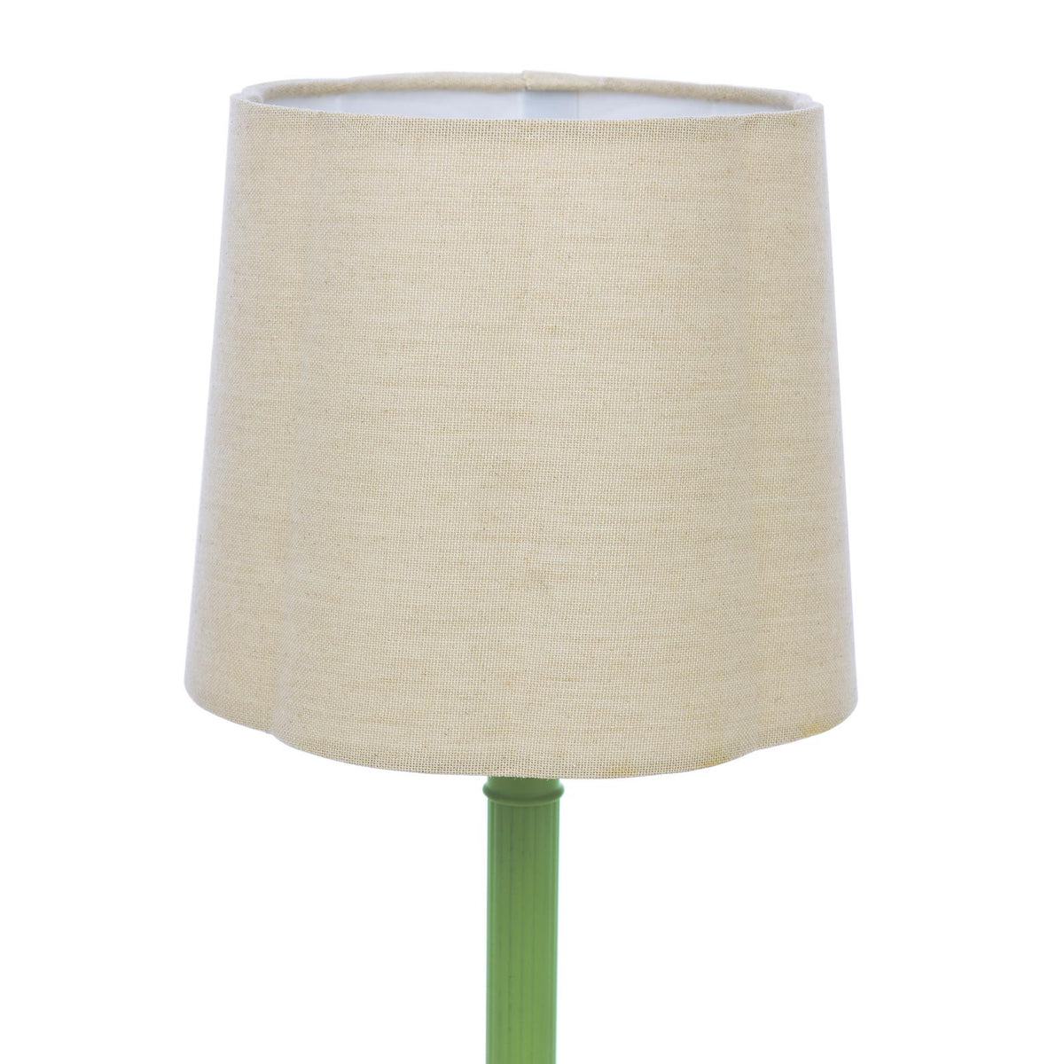 Beige fabric drum lampshade on a green lamp base