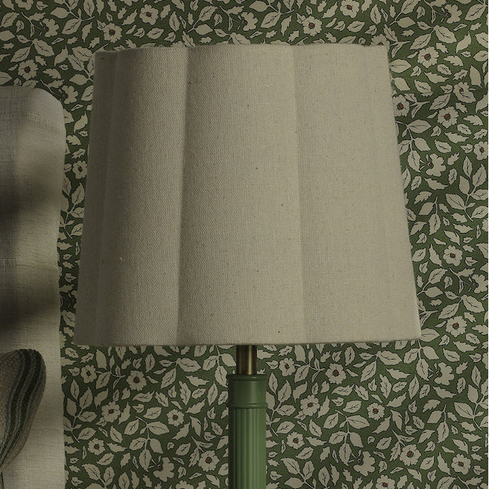 Joules Buscot table lamp with a pleated natural linen shade and a matt green base