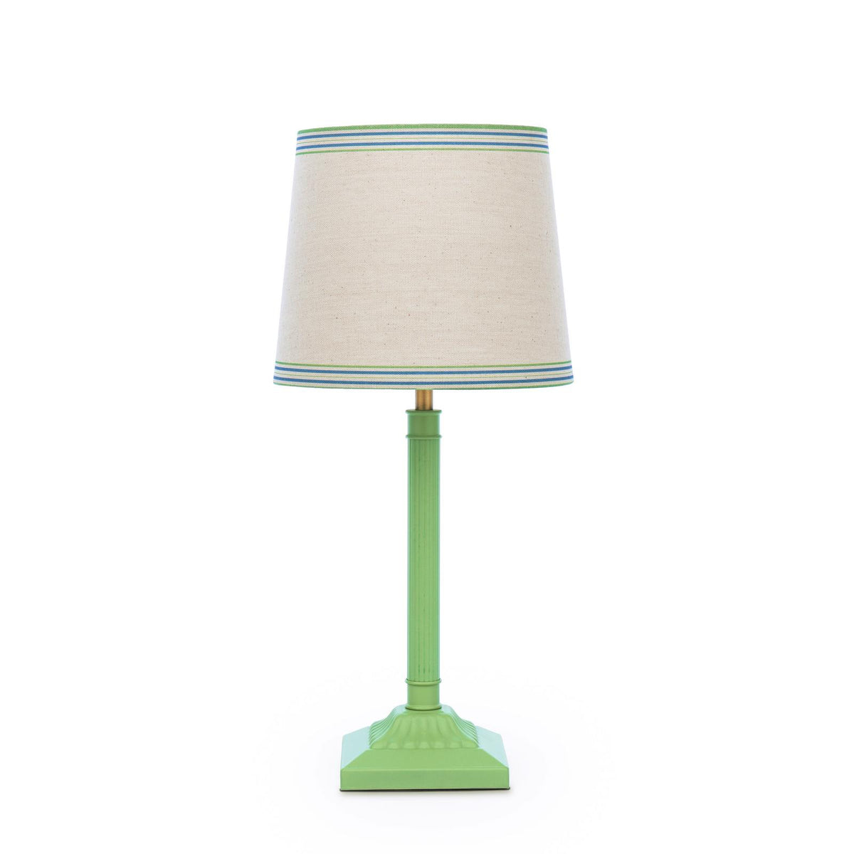 Table lamp with a green fluted base and a beige linen shade featuring blue and green striped trim