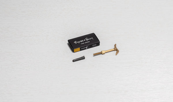 Buster + Punch The Hook in brass finish, with a wall plug and packaging