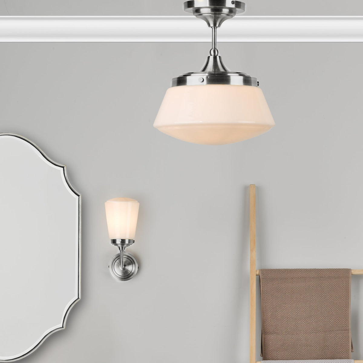Brushed nickel ceiling light with a white glass shade, a matching wall sconce, and a decorative mirror