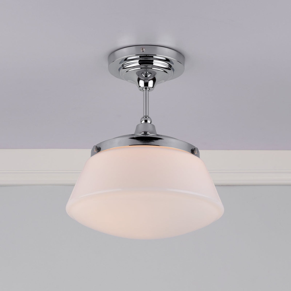 Chrome ceiling light with a white, frosted glass shade