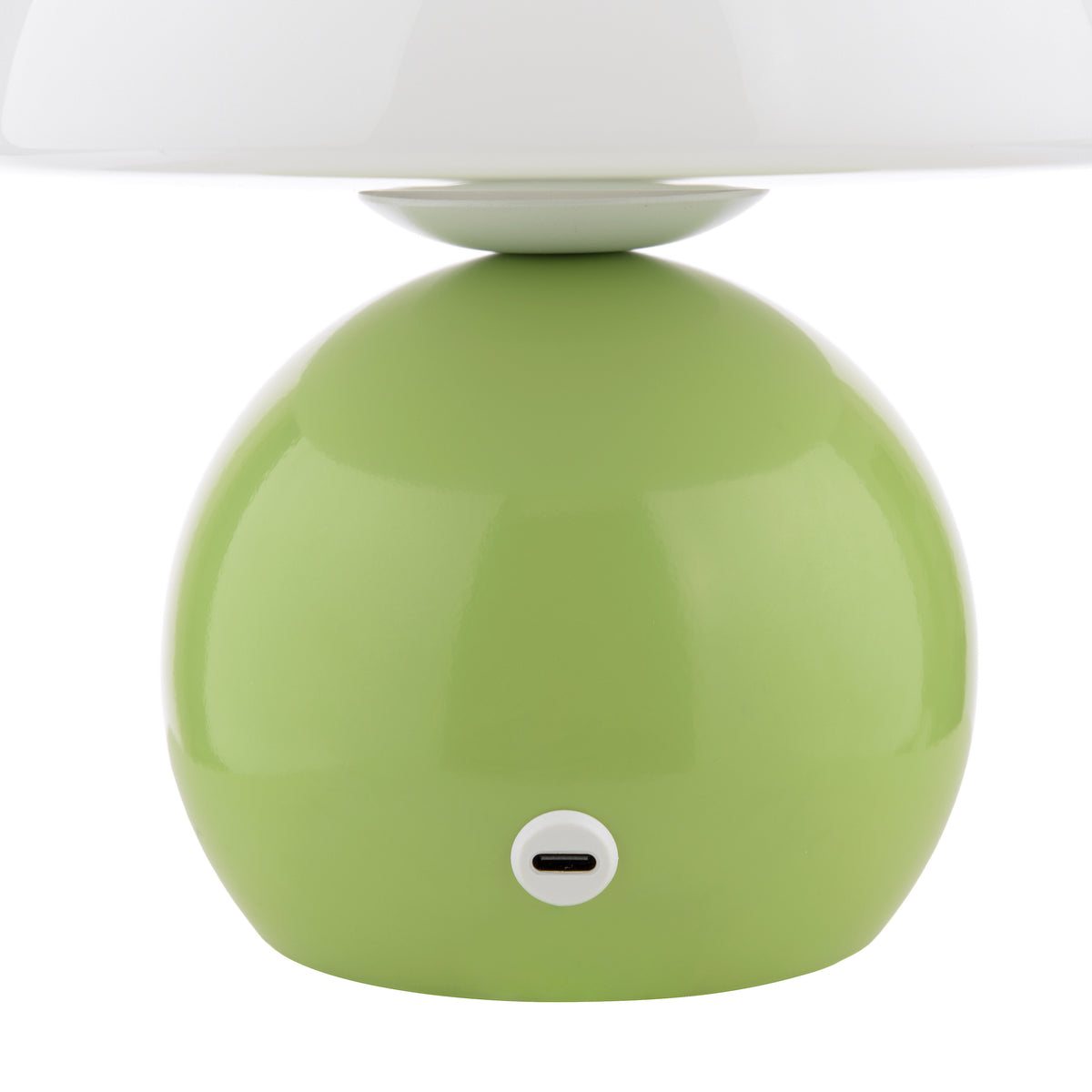 Close up of a green table lamp base with a white lampshade and a USB-C charging port