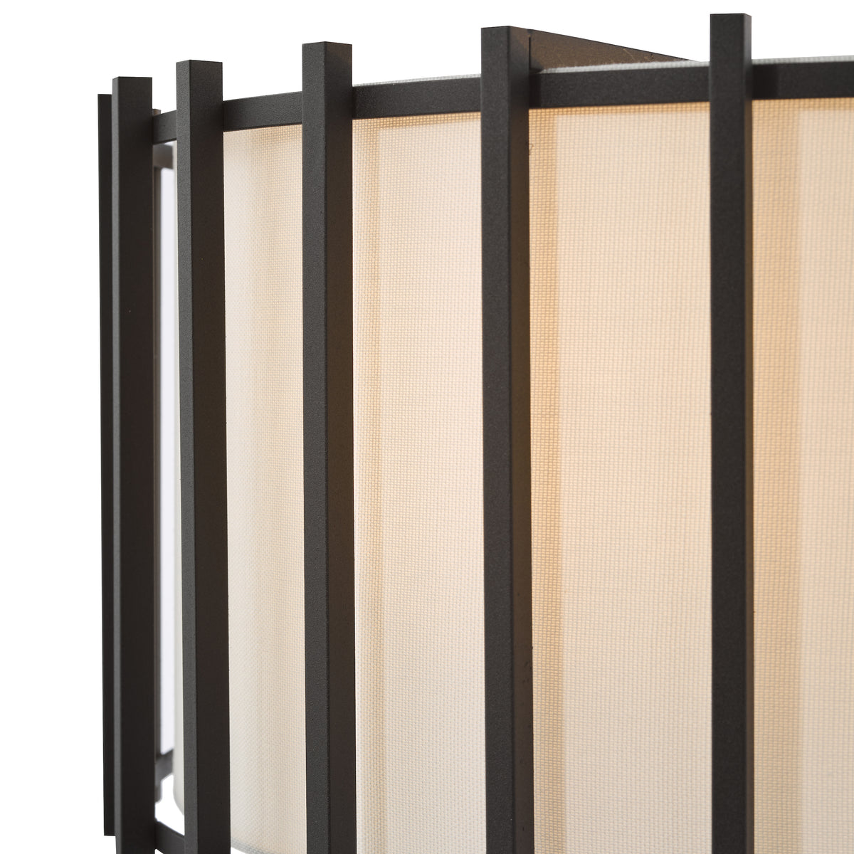 Close up of a black metal frame with a light beige fabric screen