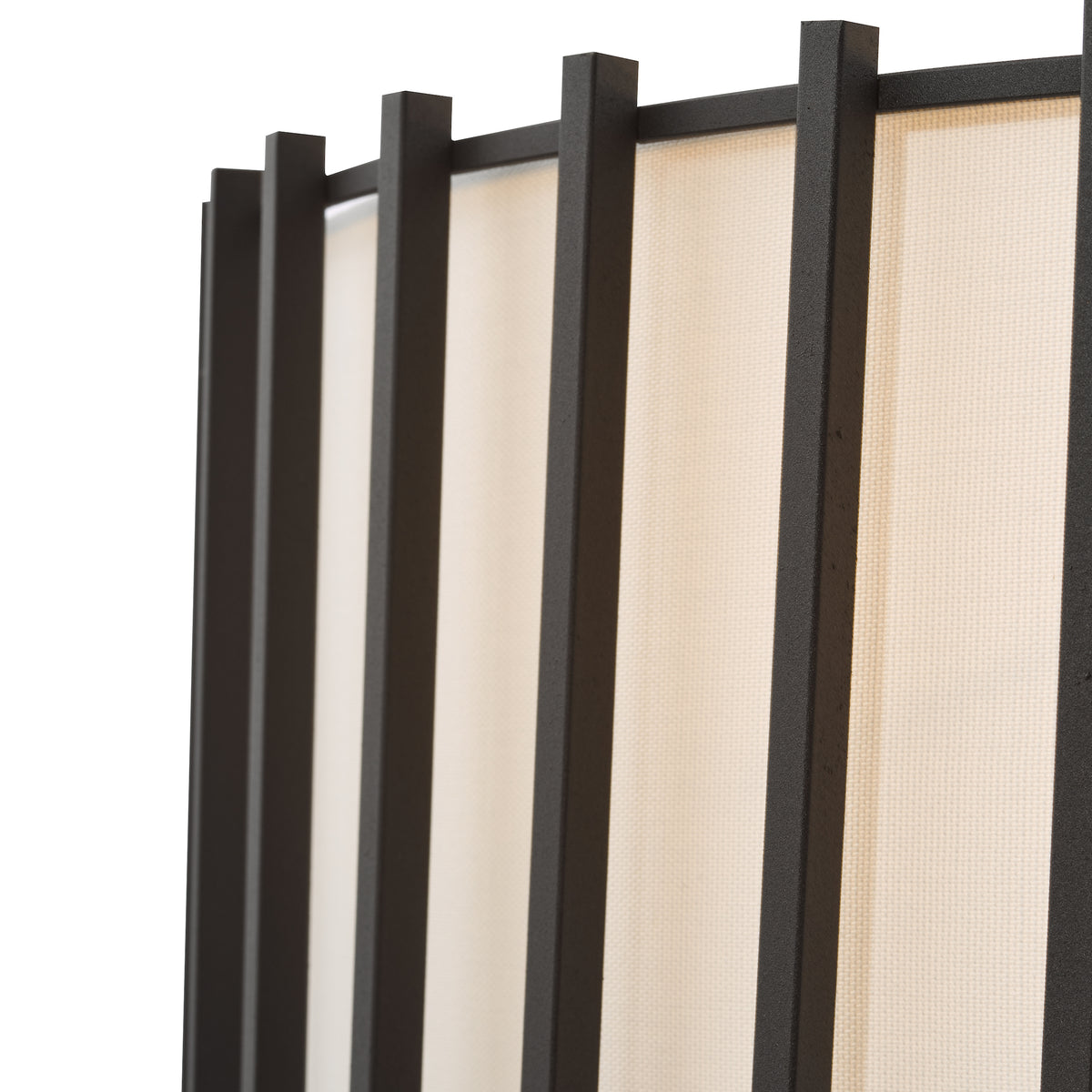 Close up of a room divider with black frames and beige fabric panels