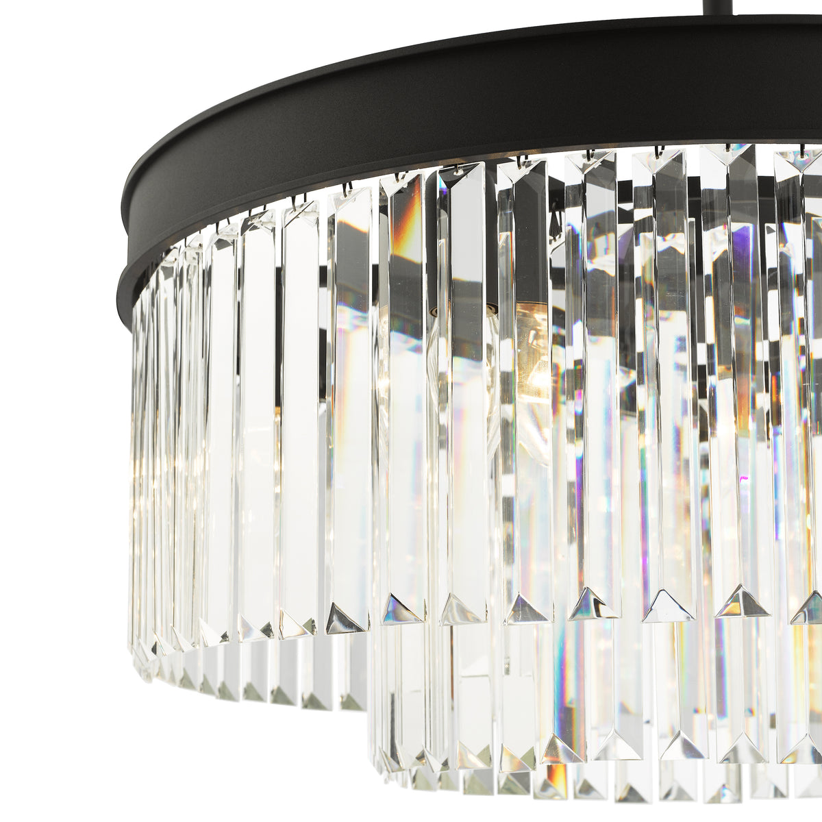 Close up of a black chandelier with two tiers of clear rectangular crystal prisms