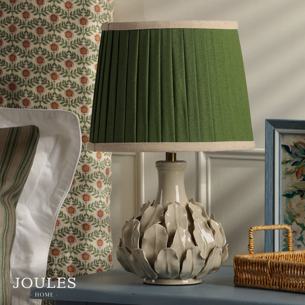Joules Chatsworth ceramic table lamp in cream with a pleated green linen shade