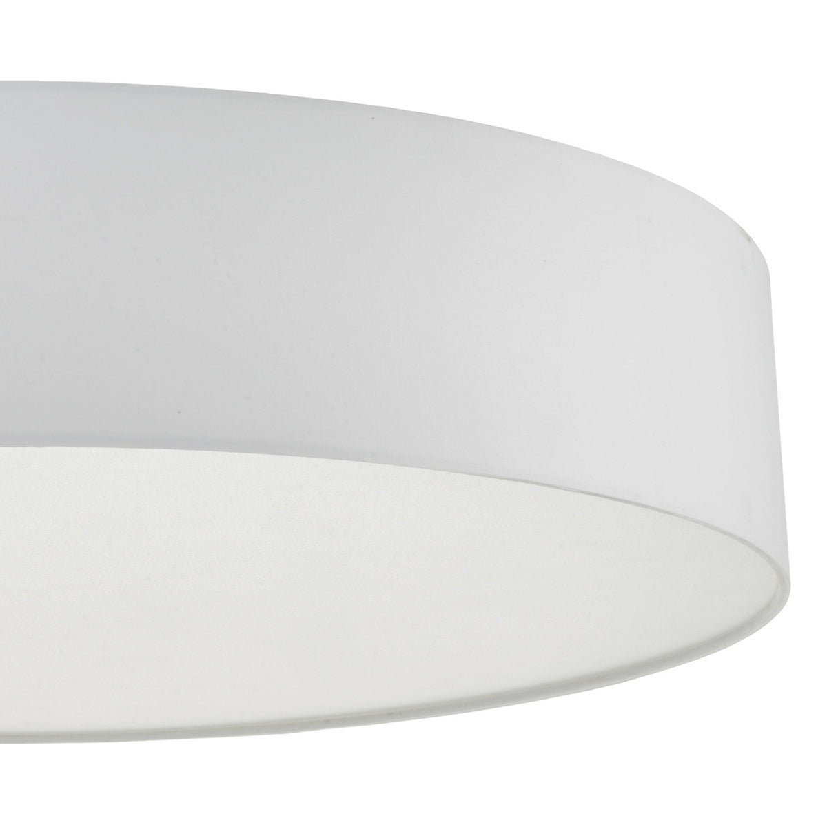 Close-up of a white fabric lampshade with a smooth, curved surface.