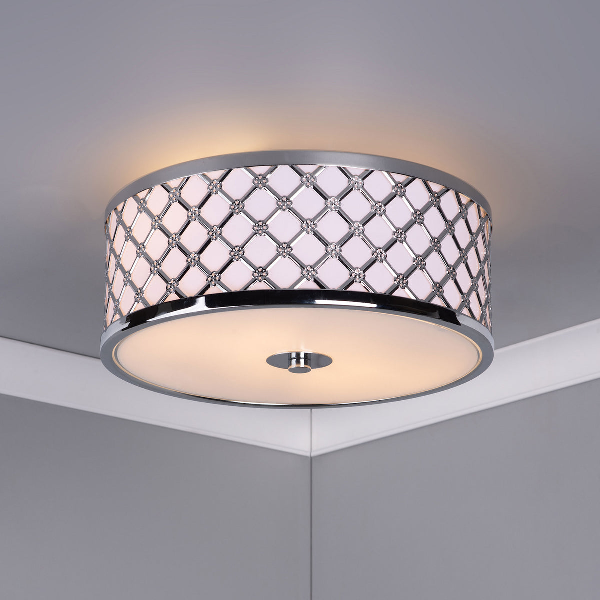 Round ceiling light with a chrome lattice pattern and small crystal accents around its drum shade.