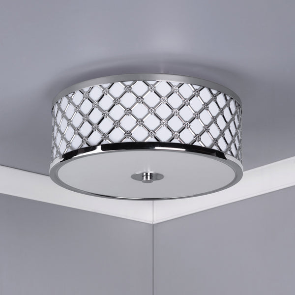 Round ceiling light with a chrome finish and a decorative diamond pattern with small floral accents.