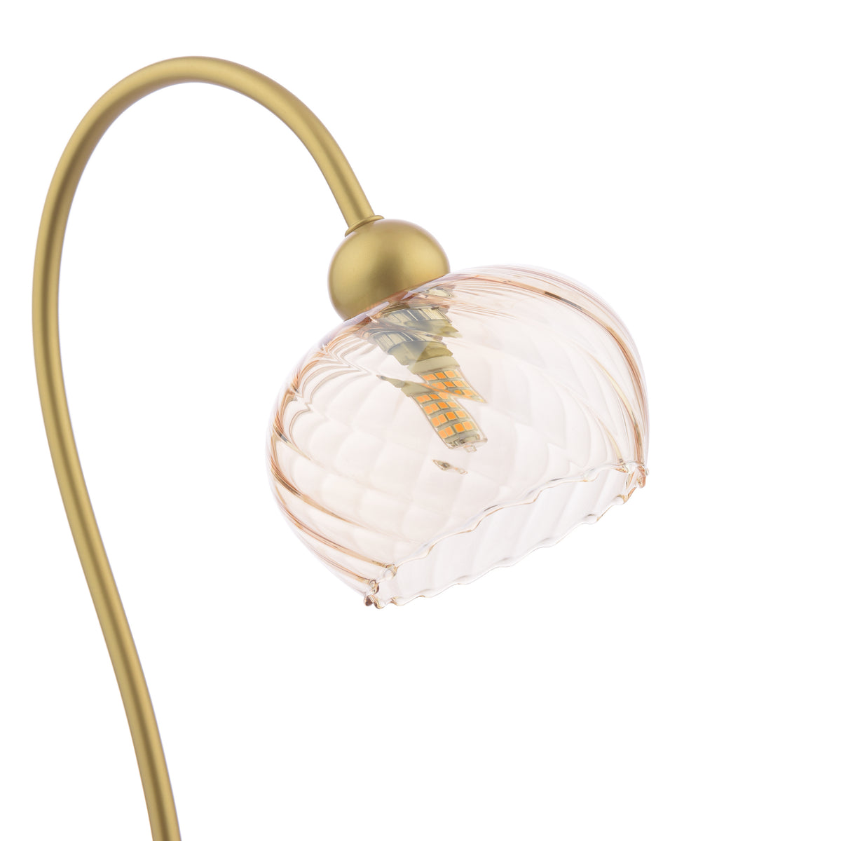 Close up of a gold lamp with a wavy glass shade and an exposed bulb