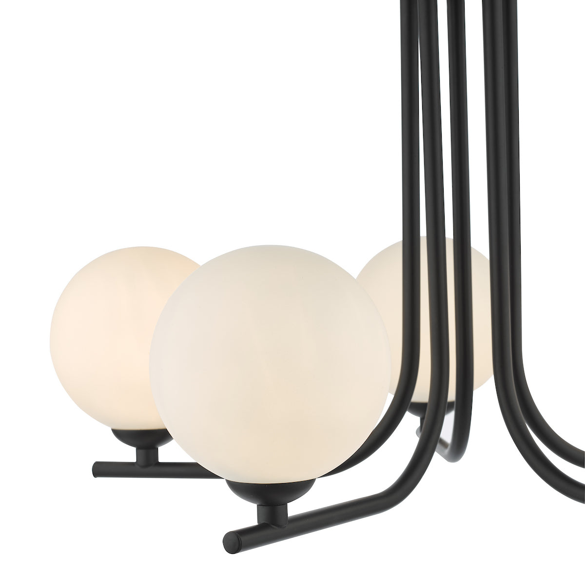 Close-up of a black chandelier with three glowing spherical white glass shades.