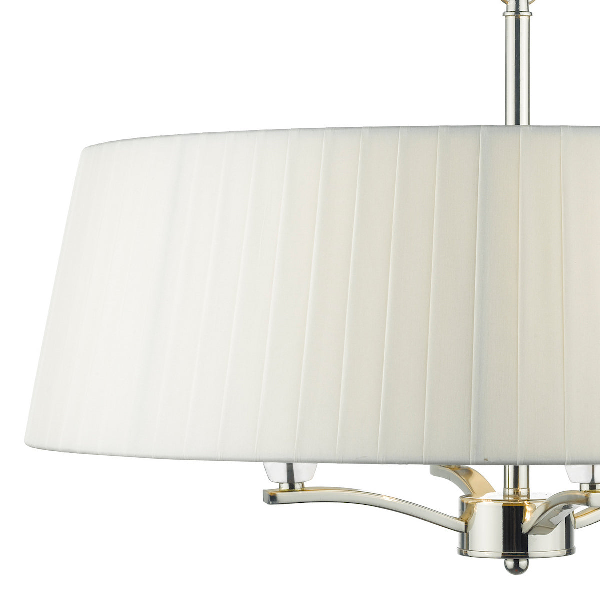 Close-up of a white pleated drum lampshade with a polished nickel base.