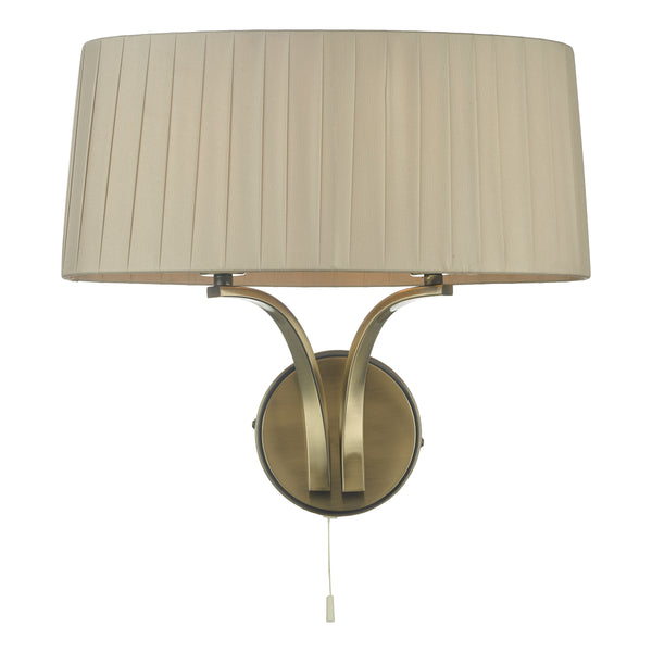 Wall light with a pleated cream fabric shade and an antique brass finish base