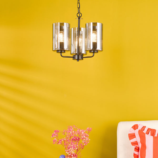 Three-light chandelier with clear glass shades and dark bronze finish