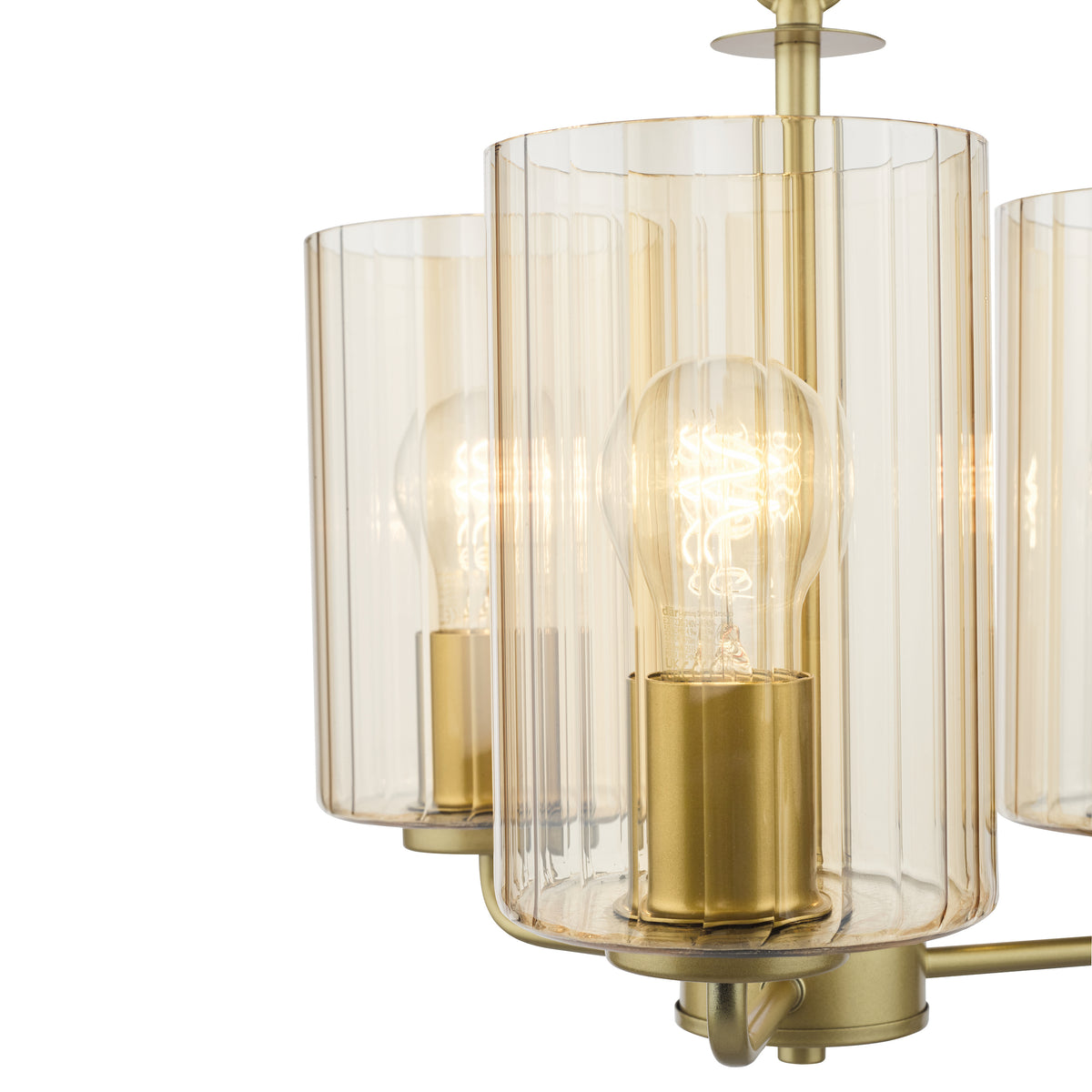 Close up of a gold chandelier with three amber ribbed glass shades