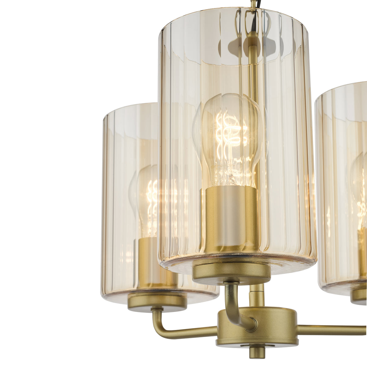 Close-up of a gold chandelier with three amber fluted glass shades and exposed filament bulbs