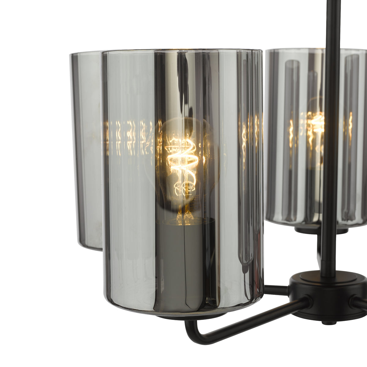 Close up of a black chandelier with three smoked glass shades, each containing an illuminated spiral filament bulb