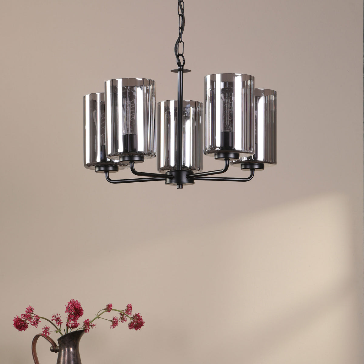 Black chandelier with five smoked glass shades