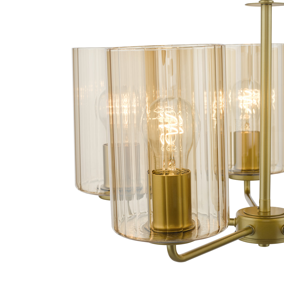 Close up of a gold chandelier with three amber ribbed glass shades and exposed filament bulbs