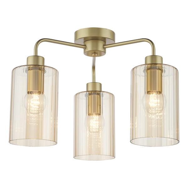 Three-light ceiling fixture with a brass finish and ribbed amber glass shades