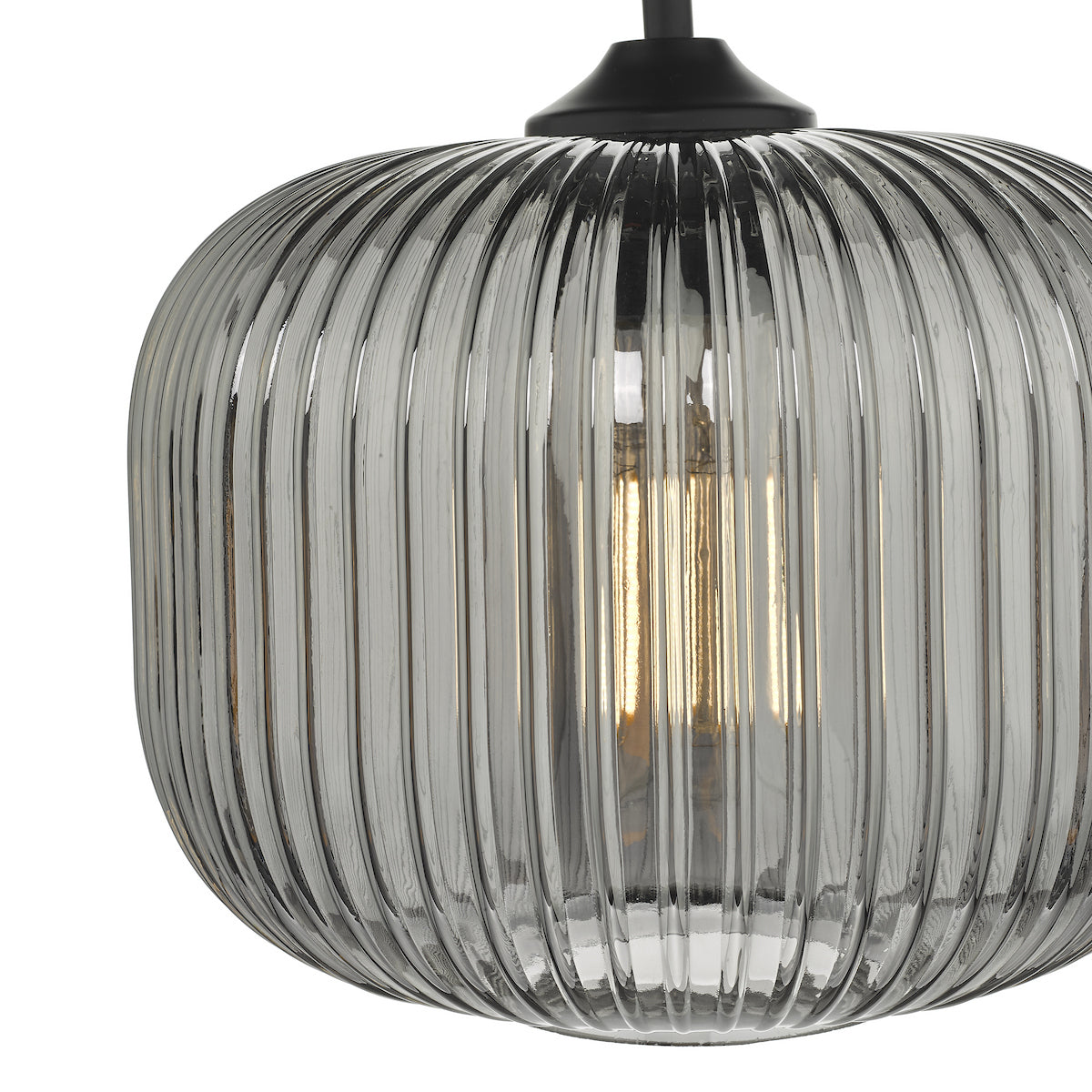 Close-up of a ribbed, smoked glass pendant light with a glowing filament bulb inside.