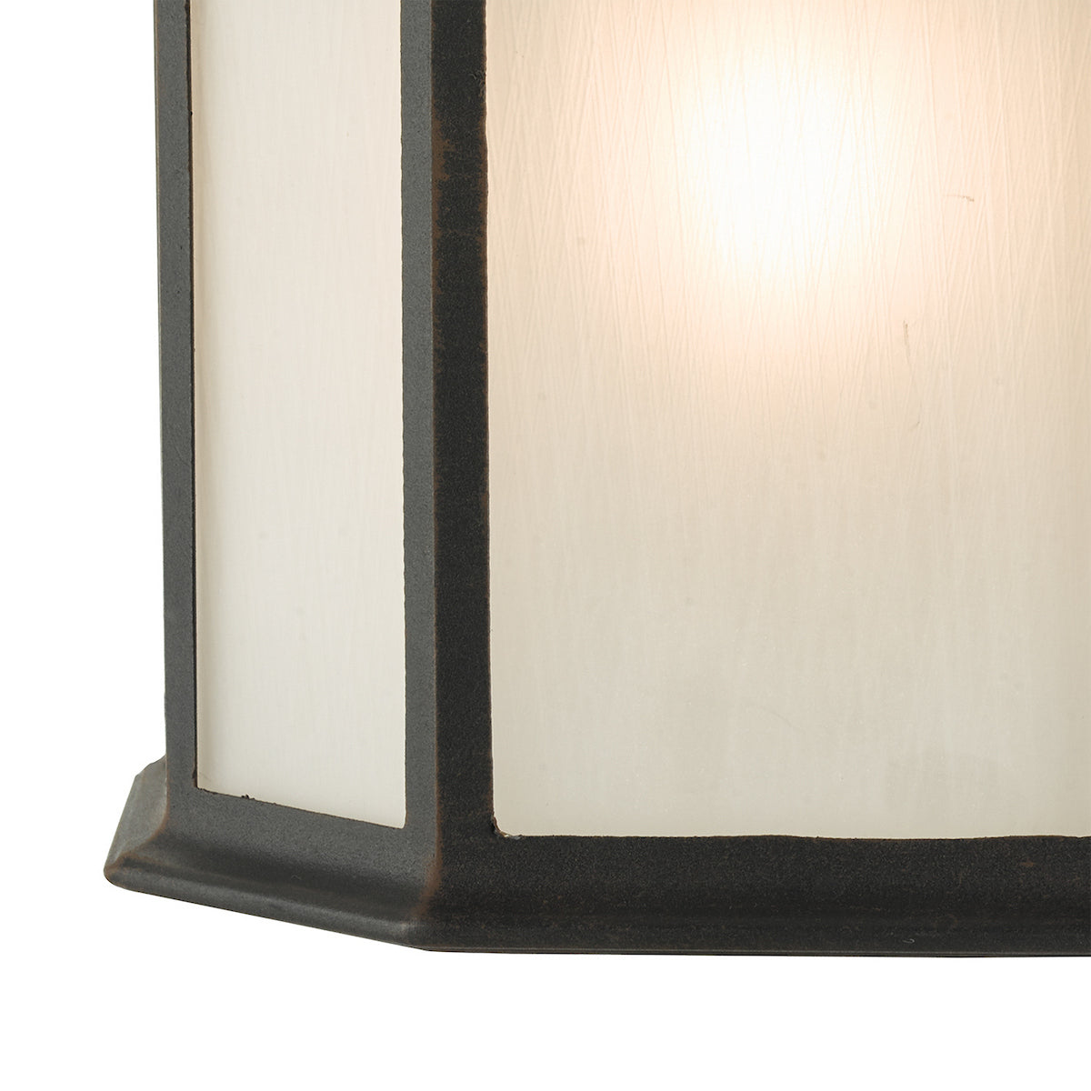 Close-up of a dark bronze outdoor wall light with frosted glass panels.