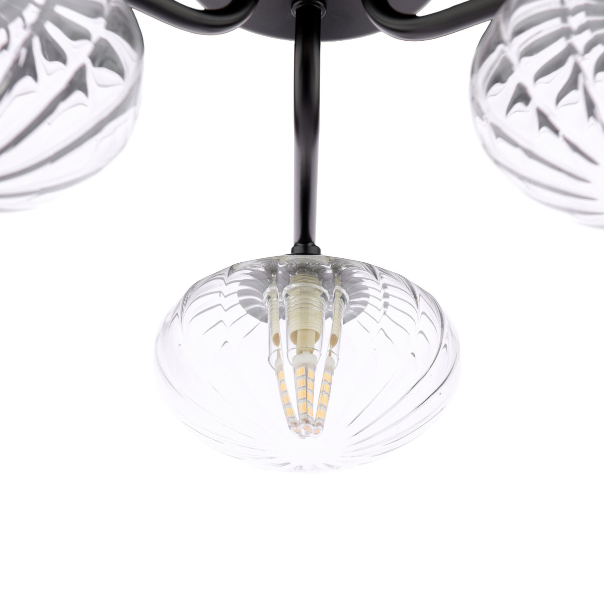 Close up of a black chandelier with three clear glass shades and LED bulbs