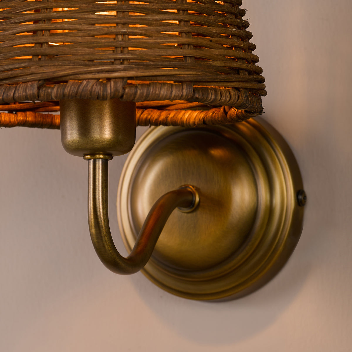 Elara Switched Wall Light in Antique Bronze with Tapered Brown Rattan Shade